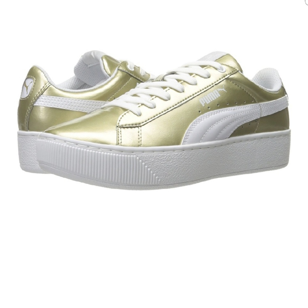 Gold and white platform Puma sneakers